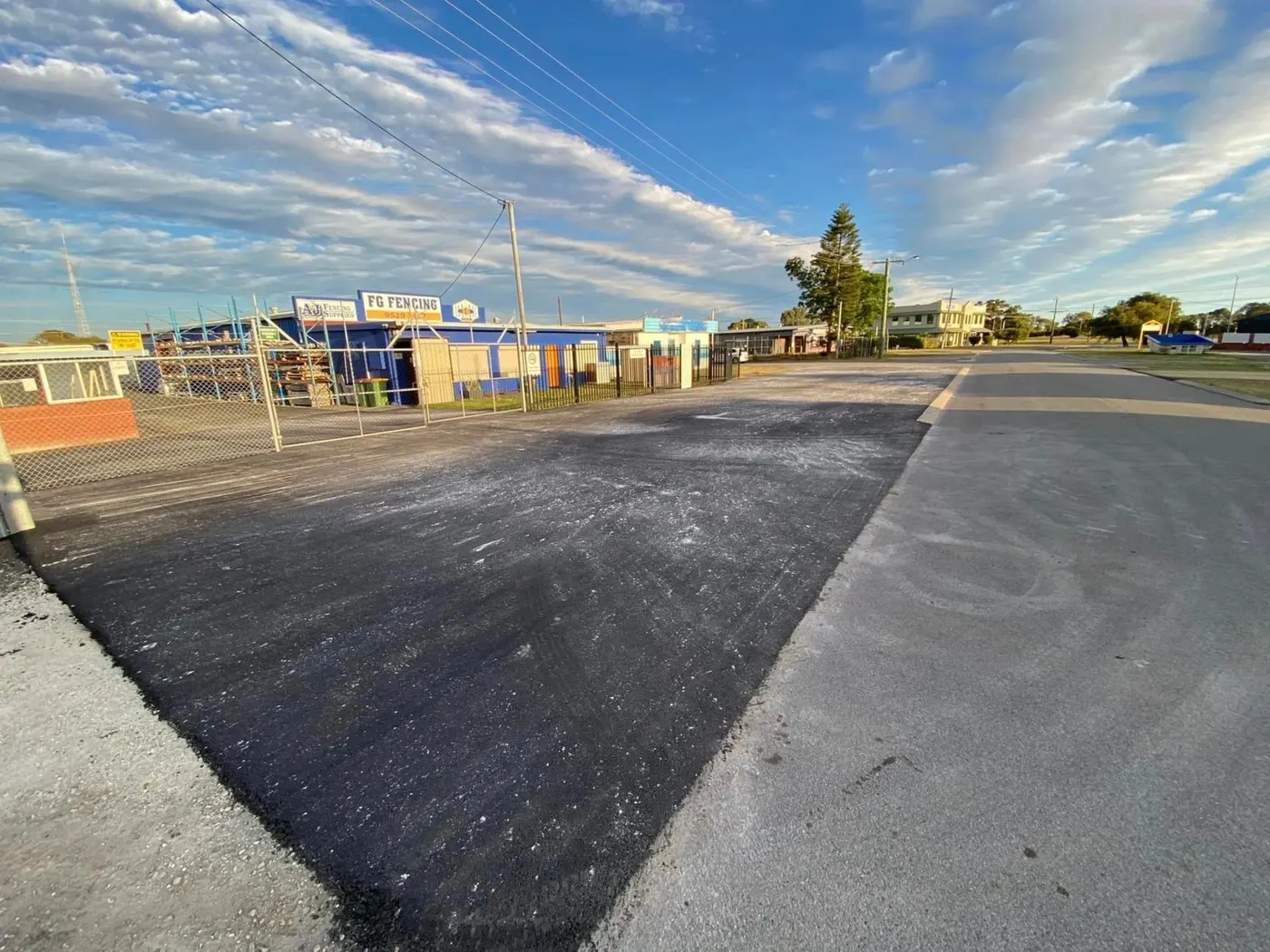 Fresh asphalt laid on a commercial street
