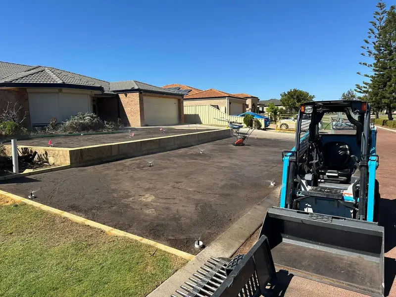 Bobcat levelling a backyard