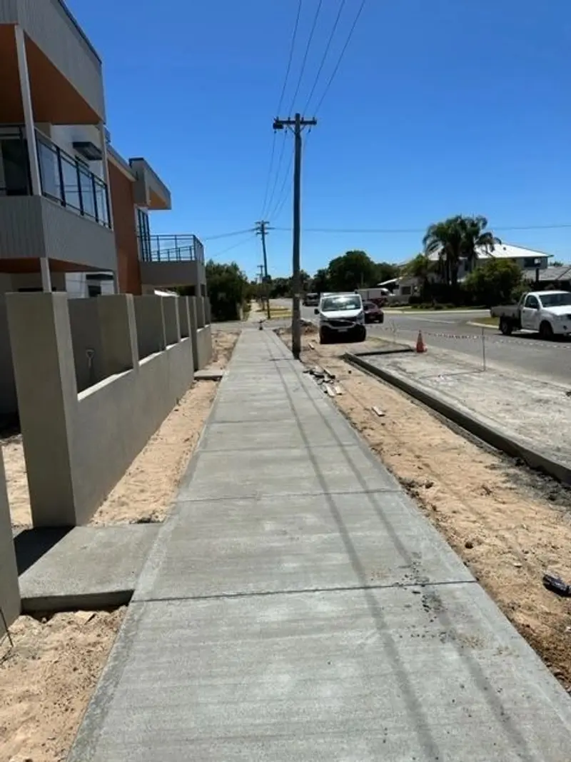 Concrete footpath along a street