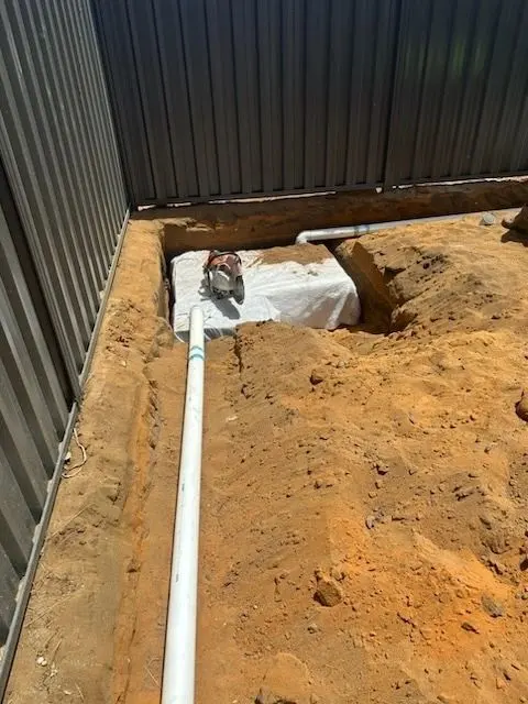 Soakwell excavation with stormwater pipe installed