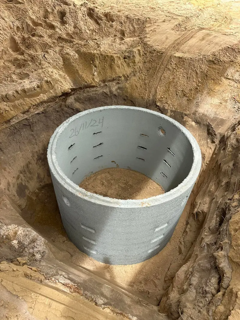 Concrete soakwell set in the excavation